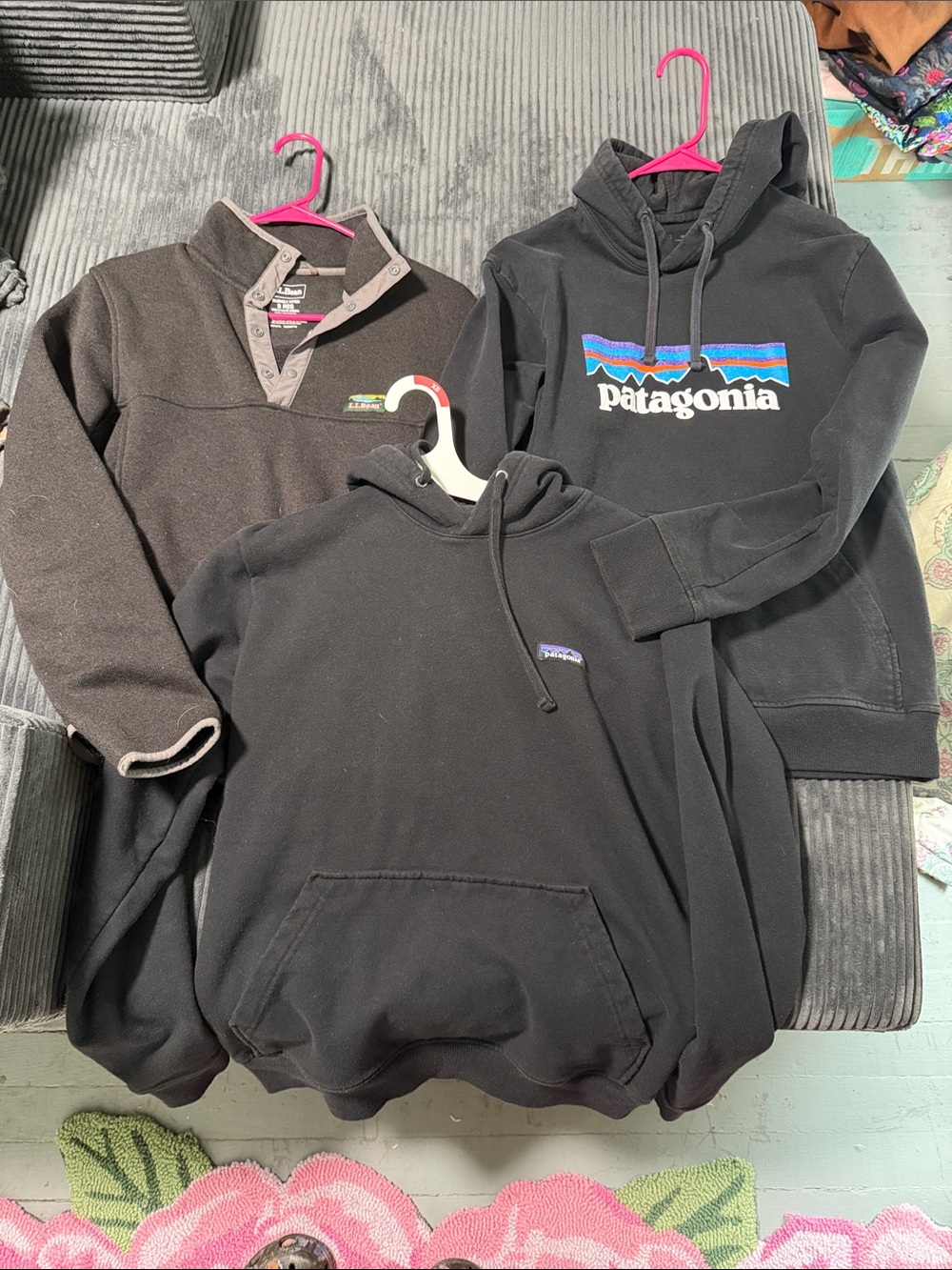 Two Patagonia Men's Black Hoodies and One LL Bean Pullover